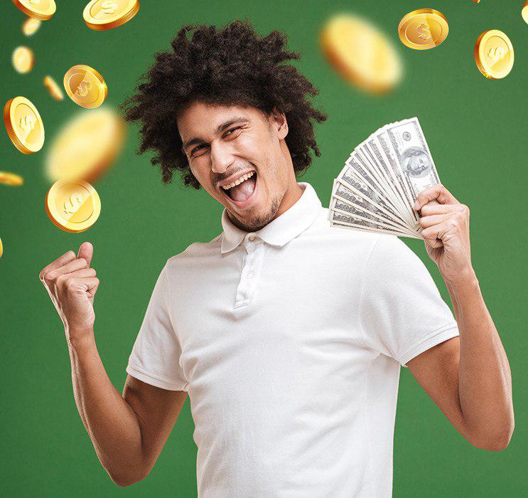 Male holding fan of money and cheering with clenched fists